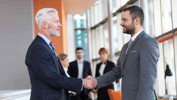 2 business men handshake